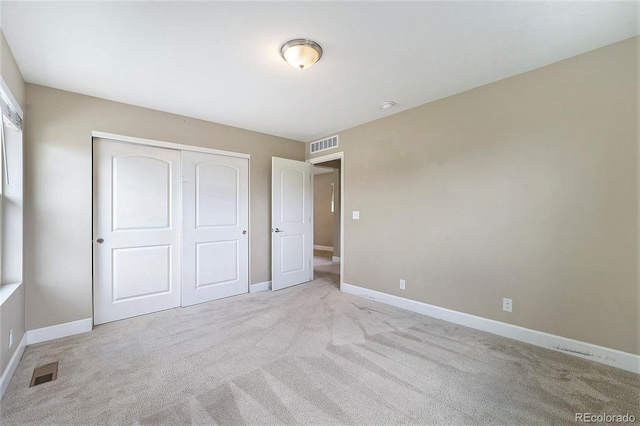 5434 N Xenia St, Denver, CO 80238 - unfurnished bedroom with light colored carpet and a closet