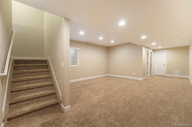 5434 N Xenia St, Denver, CO 80238 - finished below grade area with light colored carpet, recessed lighting, and stairway