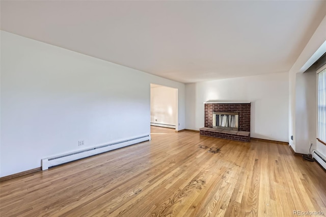 unfurnished living room with a brick fireplace, baseboards, light wood finished floors, and a baseboard radiator