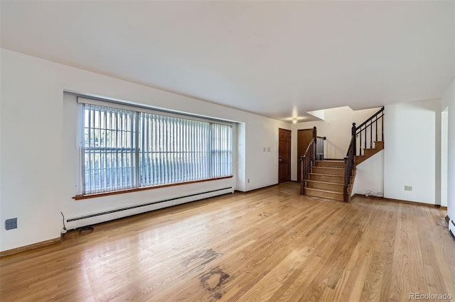 unfurnished living room with stairs, light wood-style flooring, baseboards, and a baseboard radiator