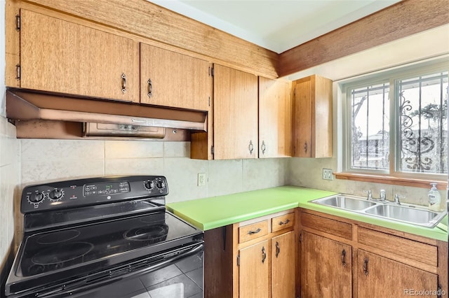 kitchen with backsplash, black range with electric stovetop, under cabinet range hood, light countertops, and a sink