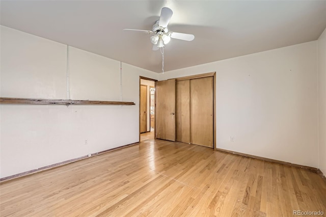 unfurnished bedroom featuring light wood-type flooring, baseboards, a closet, and ceiling fan