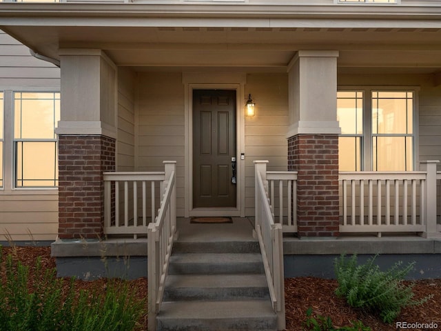 229 W Jamison Ct, Littleton, CO 80120 - doorway to property with brick siding