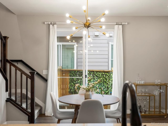 229 W Jamison Ct, Littleton, CO 80120 - dining area featuring a chandelier, stairway, and healthy amount of natural light