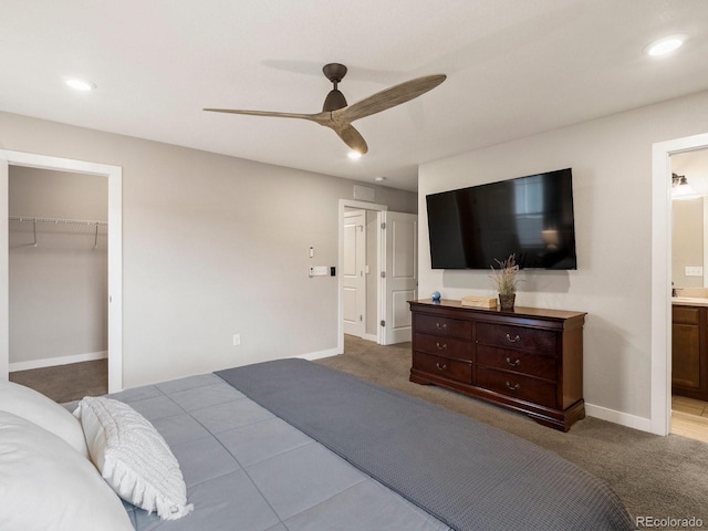 229 W Jamison Ct, Littleton, CO 80120 - bedroom featuring a spacious closet, a ceiling fan, recessed lighting, connected bathroom, and carpet floors
