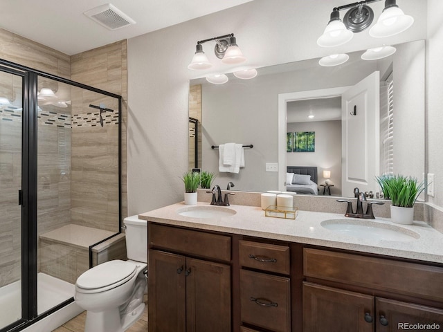 229 W Jamison Ct, Littleton, CO 80120 - ensuite bathroom with double vanity and a shower stall