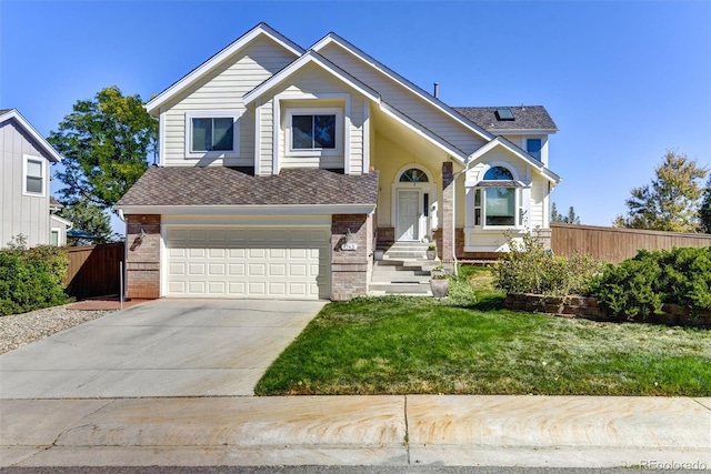 view of front of home featuring a garage and a front yard