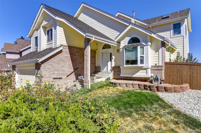 view of front of property with a garage and a front yard