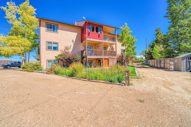 222 Cliff St Unit 3A, Silver Cliff, CO 81252 - back of property featuring fence and a balcony
