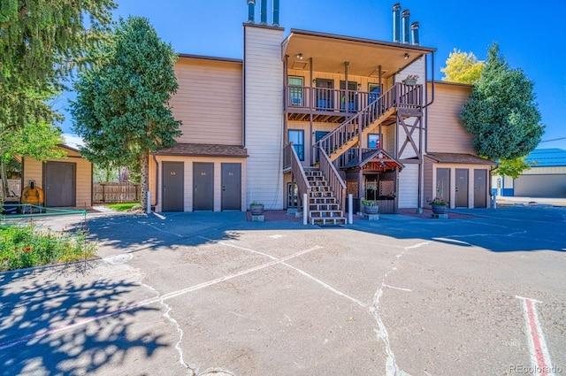 222 Cliff St Unit 3A, Silver Cliff, CO 81252 - view of front of property with a storage shed, fence, an outbuilding, and stairway