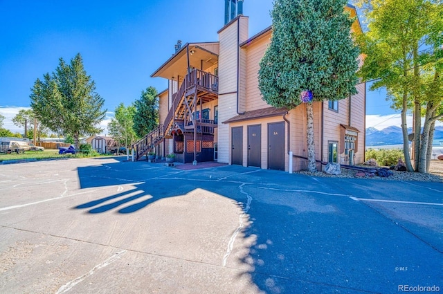 222 Cliff St Unit 3A, Silver Cliff, CO 81252 - view of building exterior with a garage and stairway