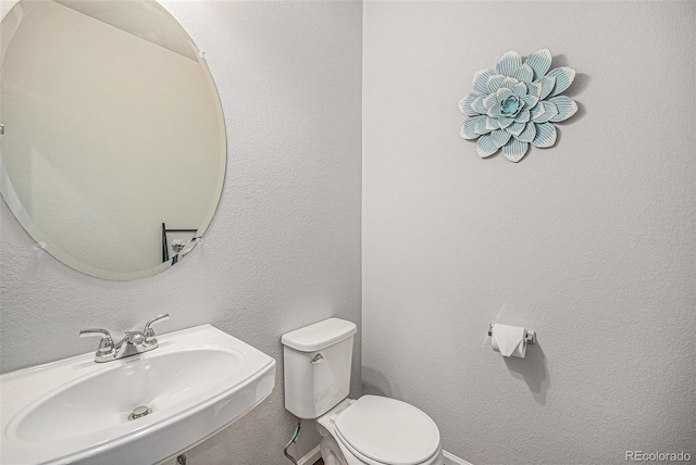 16141 Bolling Dr, Denver, CO 80239 - half bathroom featuring a sink and toilet