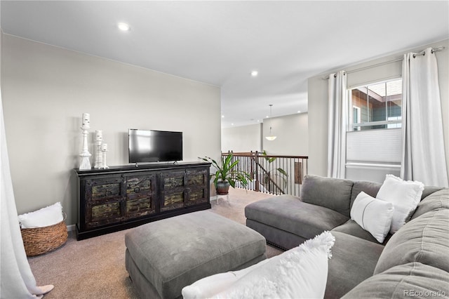 living area featuring carpet flooring and recessed lighting