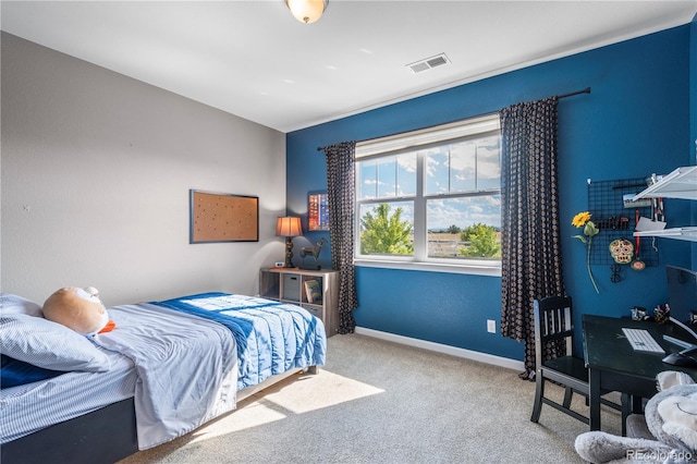 bedroom with baseboards, carpet, and visible vents