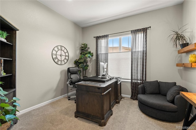 office area with baseboards and light carpet