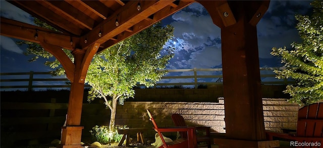 exterior space with a gazebo and fence