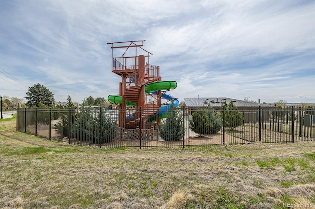 communal playground featuring fence