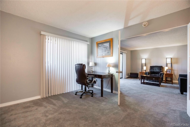 home office with carpet, a textured ceiling, and baseboards