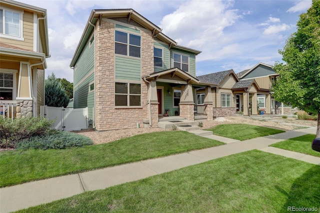 craftsman house with a front lawn