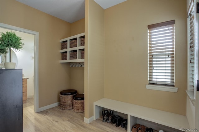 mudroom with light hardwood / wood-style floors