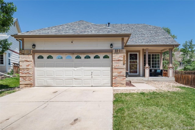 5033 Goshawk Ct, Brighton, CO 80601 - ranch-style home featuring covered porch, concrete driveway, brick siding, and roof with shingles