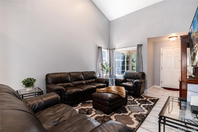 5033 Goshawk Ct, Brighton, CO 80601 - living room featuring high vaulted ceiling and baseboards
