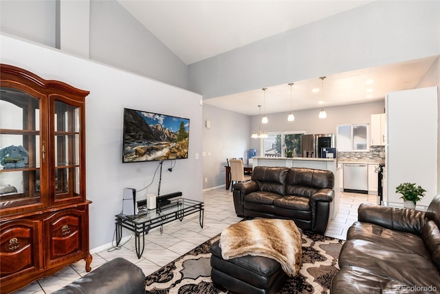5033 Goshawk Ct, Brighton, CO 80601 - living room featuring high vaulted ceiling and baseboards
