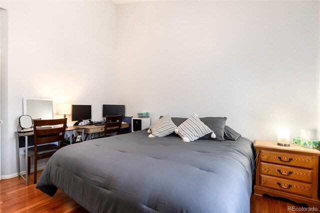 5033 Goshawk Ct, Brighton, CO 80601 - bedroom featuring wood finished floors and baseboards