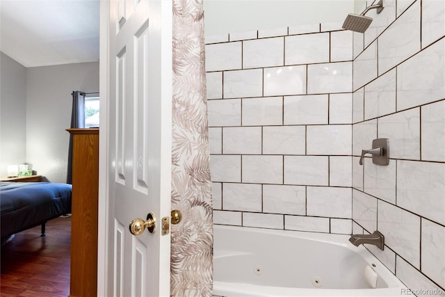 5033 Goshawk Ct, Brighton, CO 80601 - full bath with a combined bath / shower with jetted tub, ensuite bath, and wood finished floors