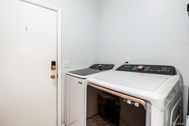 5033 Goshawk Ct, Brighton, CO 80601 - laundry area featuring independent washer and dryer and tile patterned floors