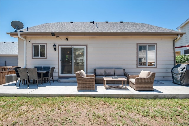 5033 Goshawk Ct, Brighton, CO 80601 - rear view of house featuring outdoor lounge area, a patio, and roof with shingles