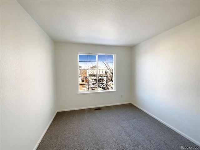 unfurnished room with carpet flooring