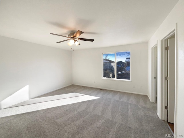 carpeted empty room with ceiling fan