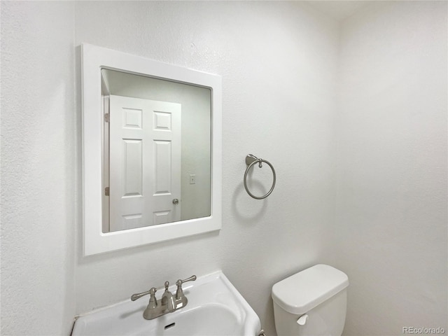 bathroom with sink and toilet