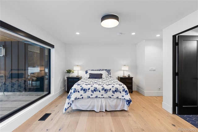 bedroom featuring visible vents, light wood-style flooring, access to outside, recessed lighting, and baseboards