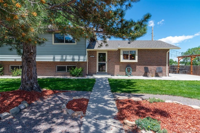 16225 W 74th Dr, Arvada, CO 80007 - split level home with a patio and brick siding