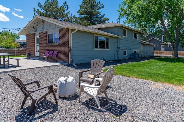 16225 W 74th Dr, Arvada, CO 80007 - back of house with a patio and brick siding