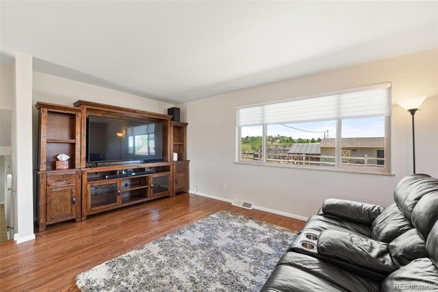16225 W 74th Dr, Arvada, CO 80007 - living area featuring wood finished floors and baseboards