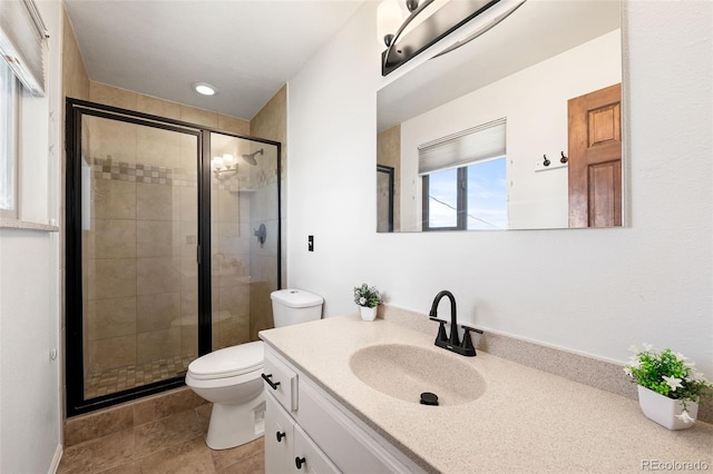 16225 W 74th Dr, Arvada, CO 80007 - bathroom with toilet, vanity, and a shower stall