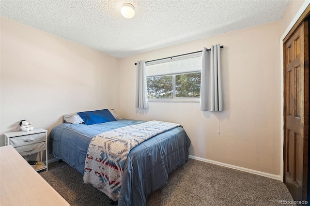 16225 W 74th Dr, Arvada, CO 80007 - bedroom featuring carpet floors, a textured ceiling, and baseboards