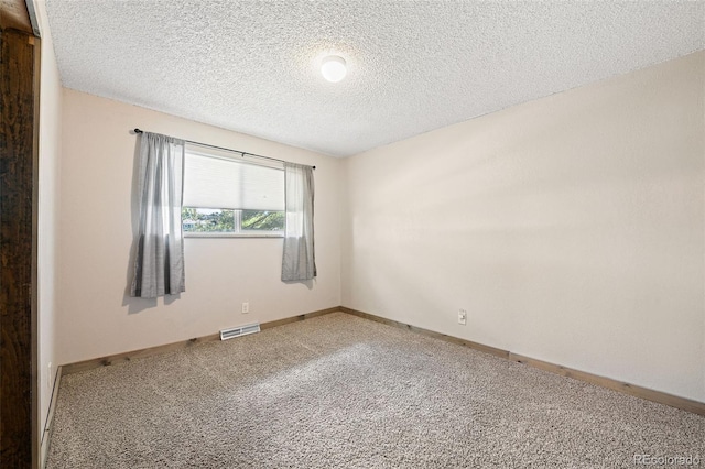 16225 W 74th Dr, Arvada, CO 80007 - carpeted spare room featuring a textured ceiling and baseboards