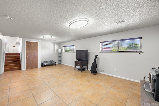 16225 W 74th Dr, Arvada, CO 80007 - home office with a textured ceiling, light tile patterned floors, and baseboards