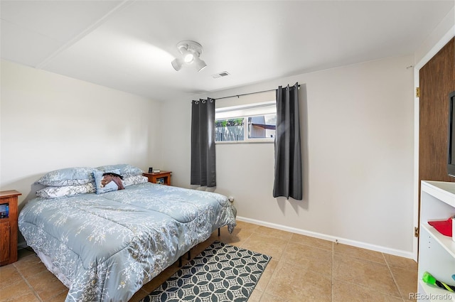 16225 W 74th Dr, Arvada, CO 80007 - tiled bedroom featuring baseboards