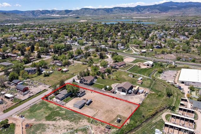 16225 W 74th Dr, Arvada, CO 80007 - aerial view of property and surrounding area featuring a water and mountain view and property parcel outlined