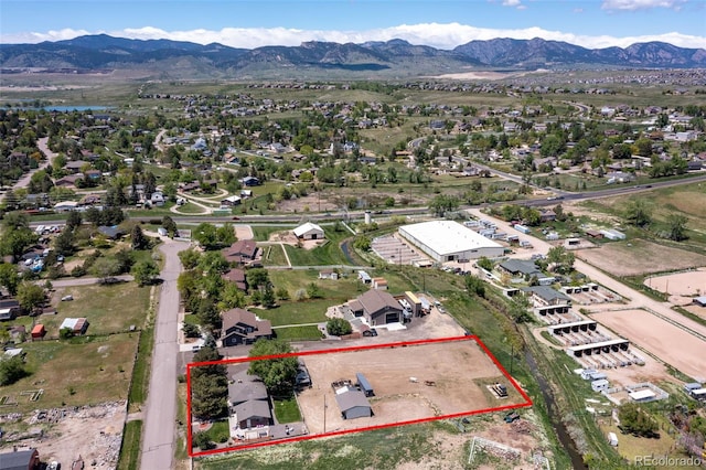 16225 W 74th Dr, Arvada, CO 80007 - aerial view of property and surrounding area with mountains and property parcel outlined
