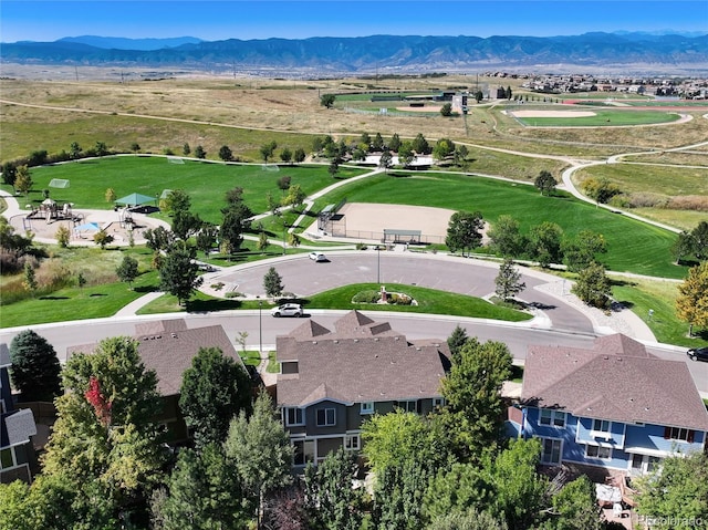 drone / aerial view featuring a residential view and a mountain view