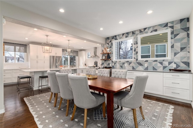 dining room featuring dark wood finished floors and recessed lighting