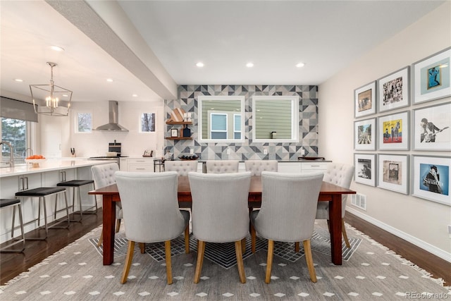 dining area with a notable chandelier, recessed lighting, visible vents, baseboards, and dark wood finished floors