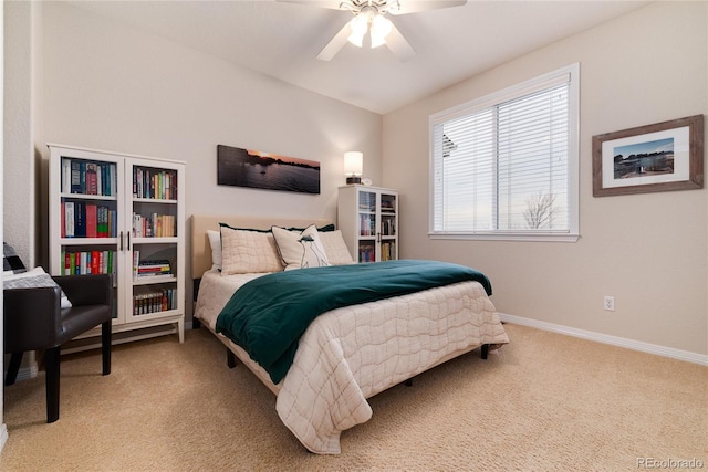 carpeted bedroom featuring ceiling fan and baseboards