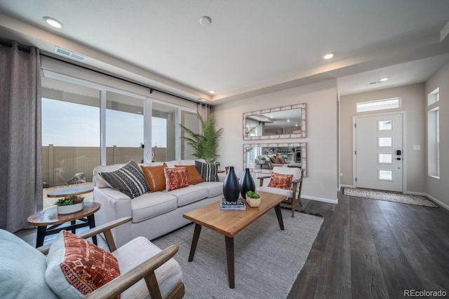 living room with dark hardwood / wood-style flooring